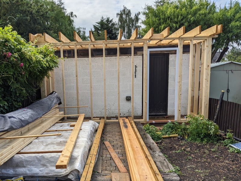 Exterior view of the timber frame under construction.